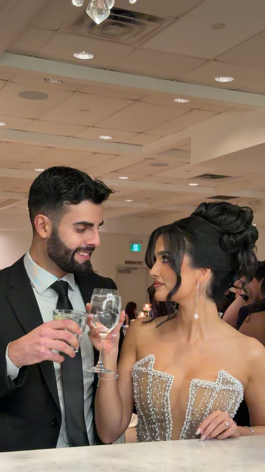 A couple sharing a champagne toast